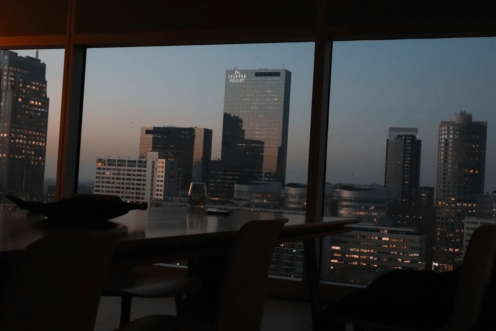 Boardroom overlooking the city at dusk